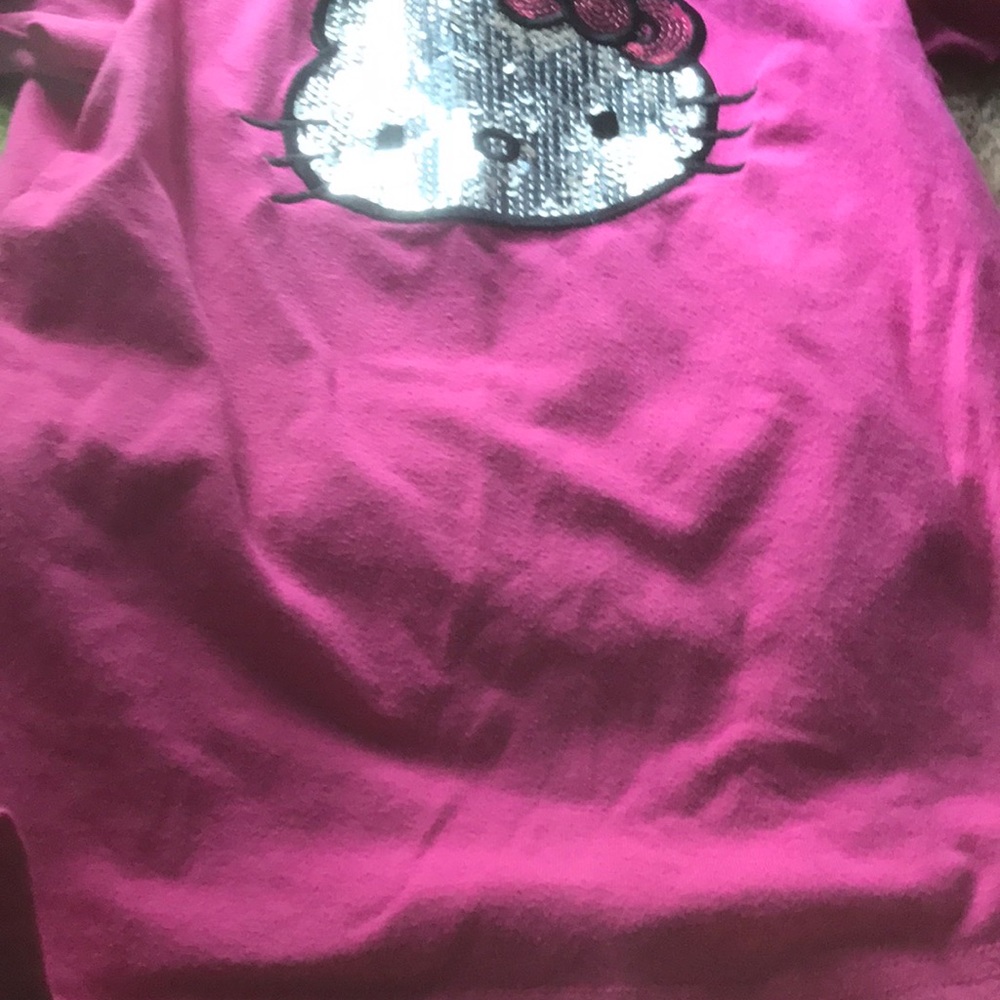 A pink sparkly hello kitty top